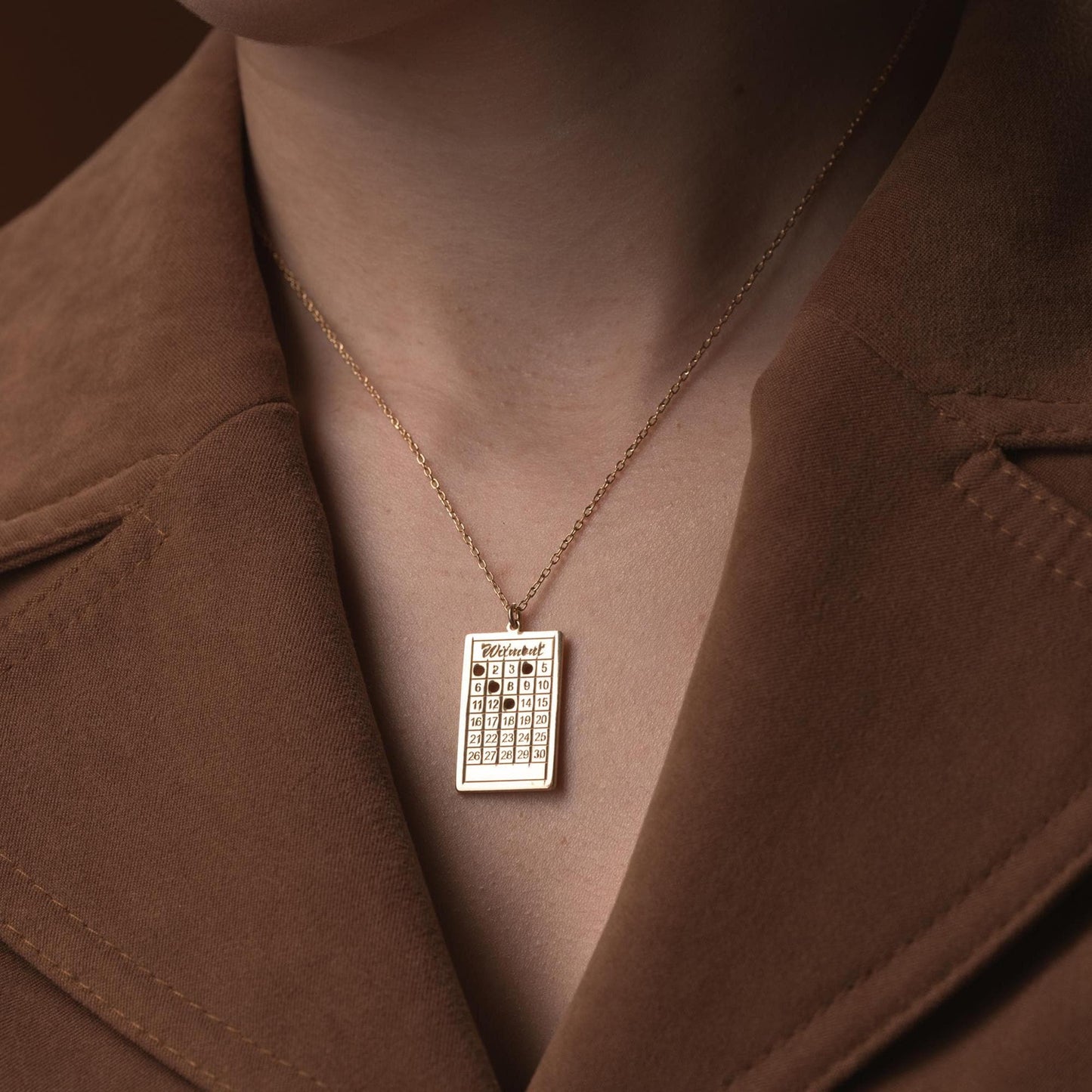 A rectangular calendar pendant necklace, engraved with a custom date and name, crafted from 925 Sterling Silver or 14K Gold Plated. Ideal for anniversaries, weddings, and birthday gifts.