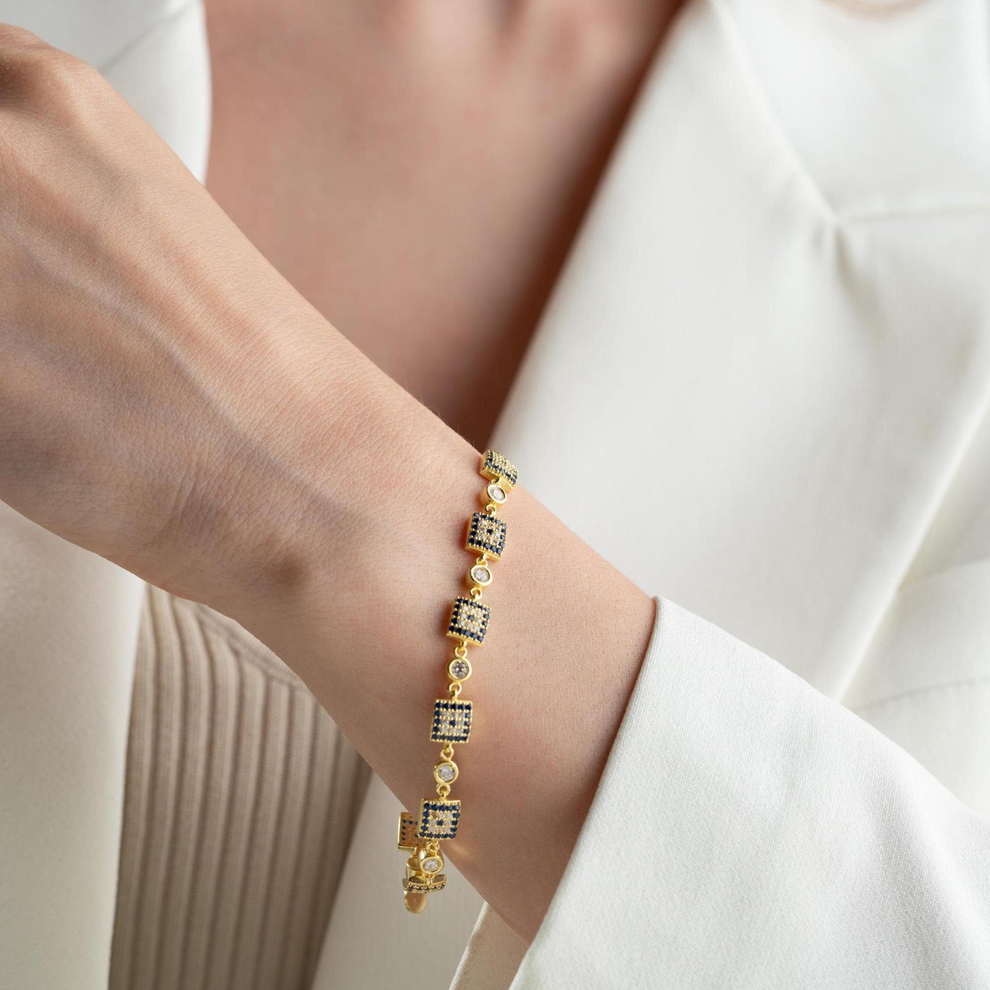 Square motif charm bracelet in 925 Sterling Silver with cubic zirconia stones, available in silver and gold finishes, perfect for Christmas gifts.