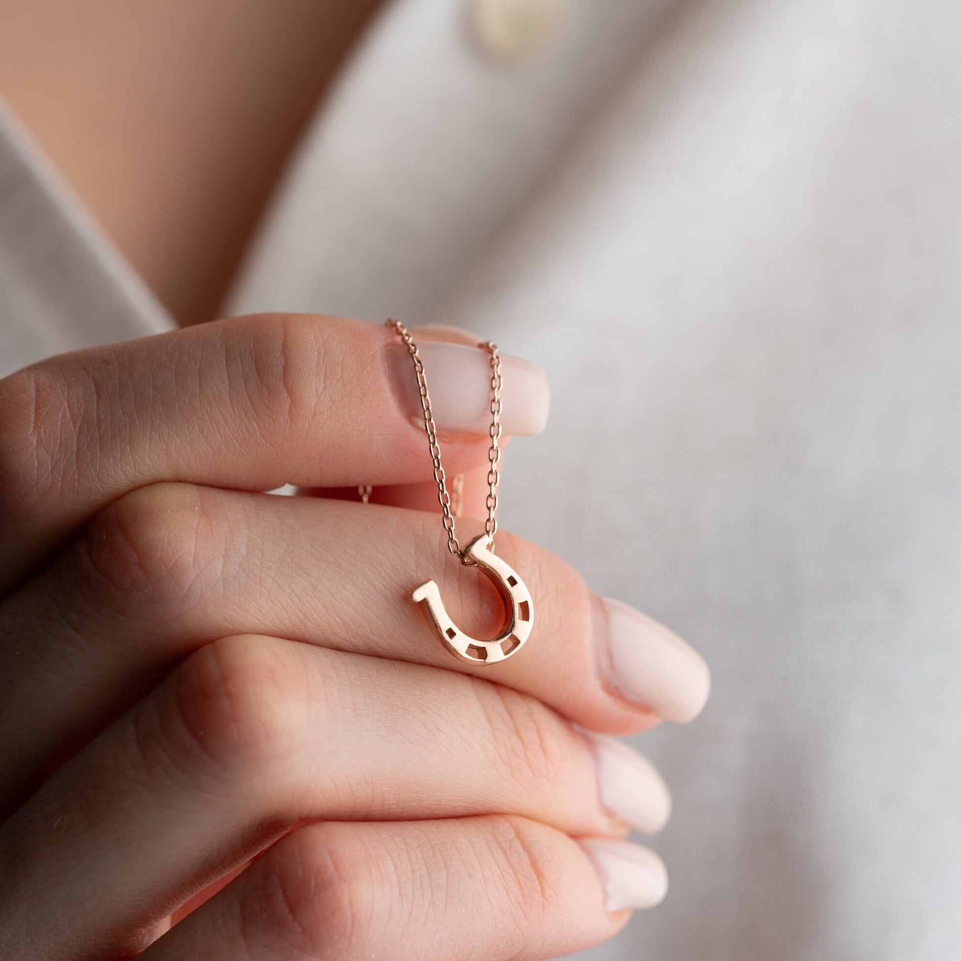 925 Sterling Silver Necklace adorned with zircon stones and featuring a horseshoe symbol, available in multiple colors and lengths.