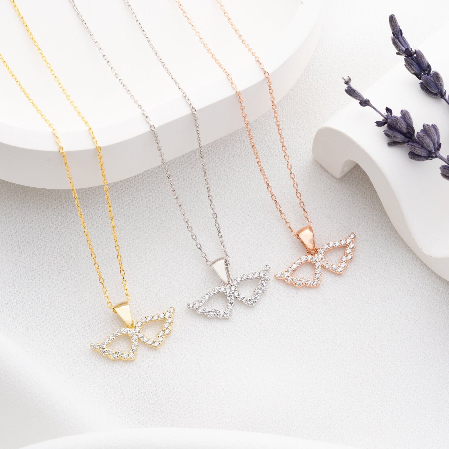 Elegant 925 sterling silver angel wing necklace, adorned with sparkling zircon stones, ideal as a protective charm or Mother&#39;s Day gift.