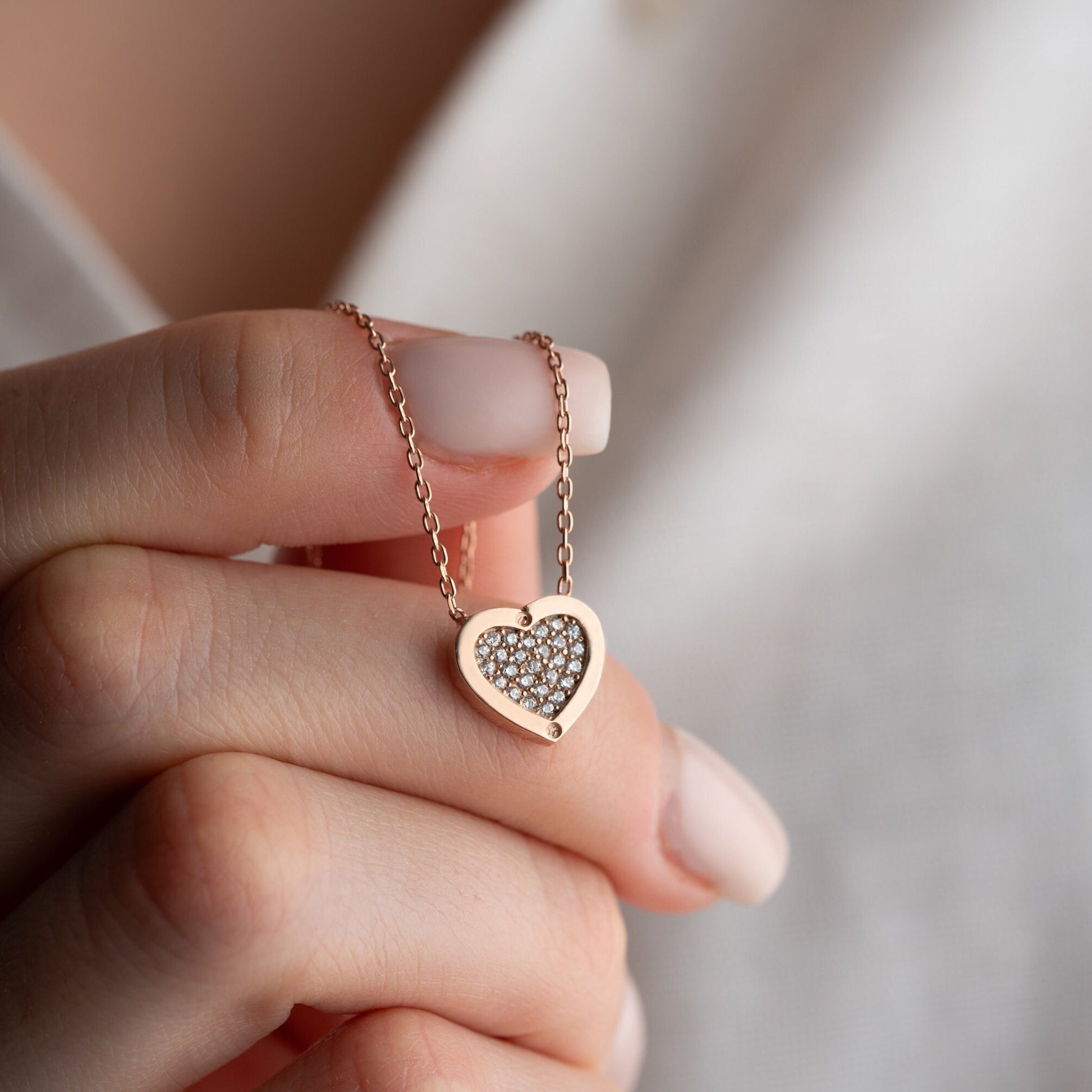 Elegant heart-shaped necklace crafted from 925 sterling silver, adorned with a central zircon stone, presented in a gift box