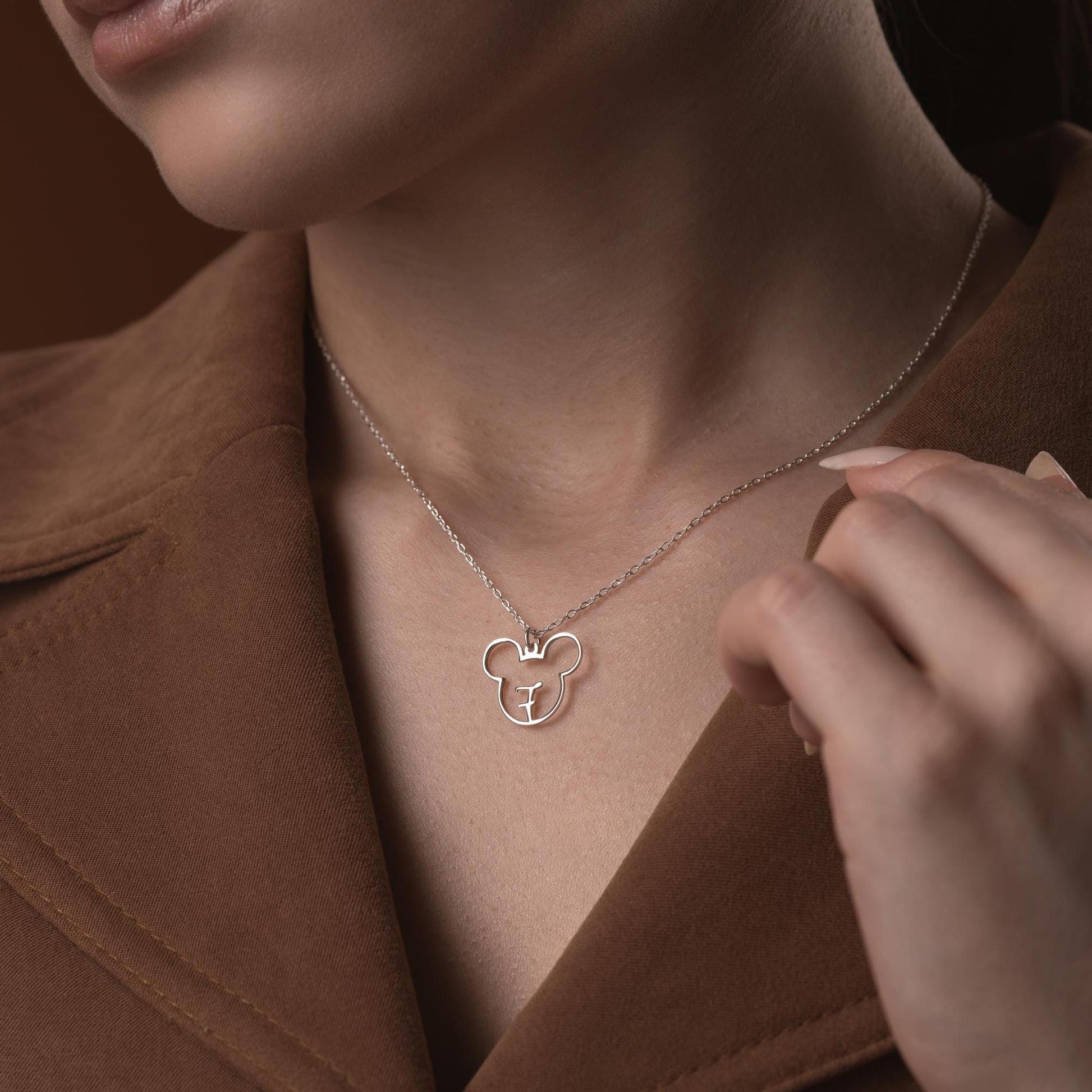 Custom initial necklace with a unique letter-in-pendant design, crafted in 925 sterling silver or 14k gold plated. A personalized and elegant handmade jewelry gift.