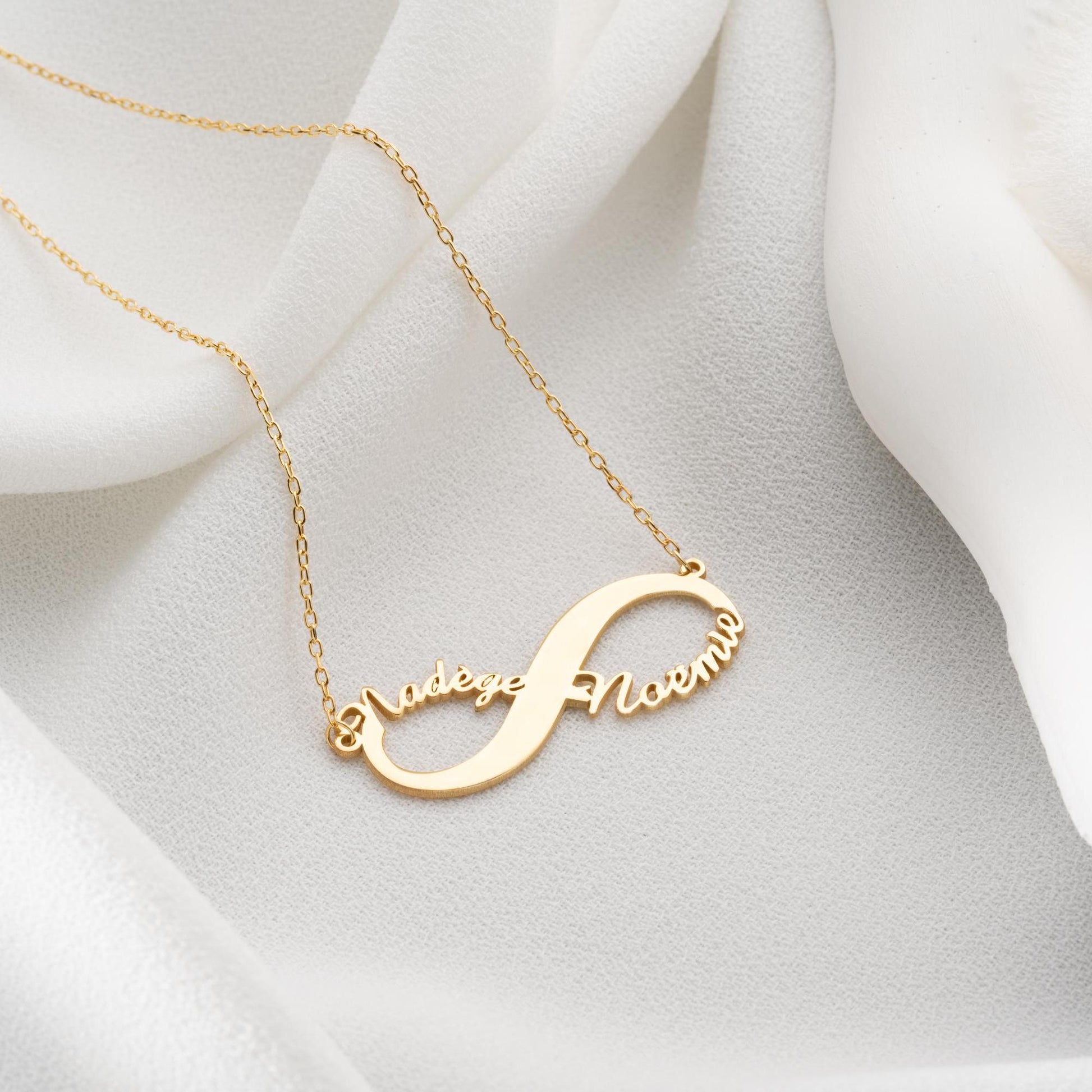 Custom infinity necklace with two personalized names, crafted in 925 sterling silver and 14k gold plated options. A timeless symbol of eternal love and unity.