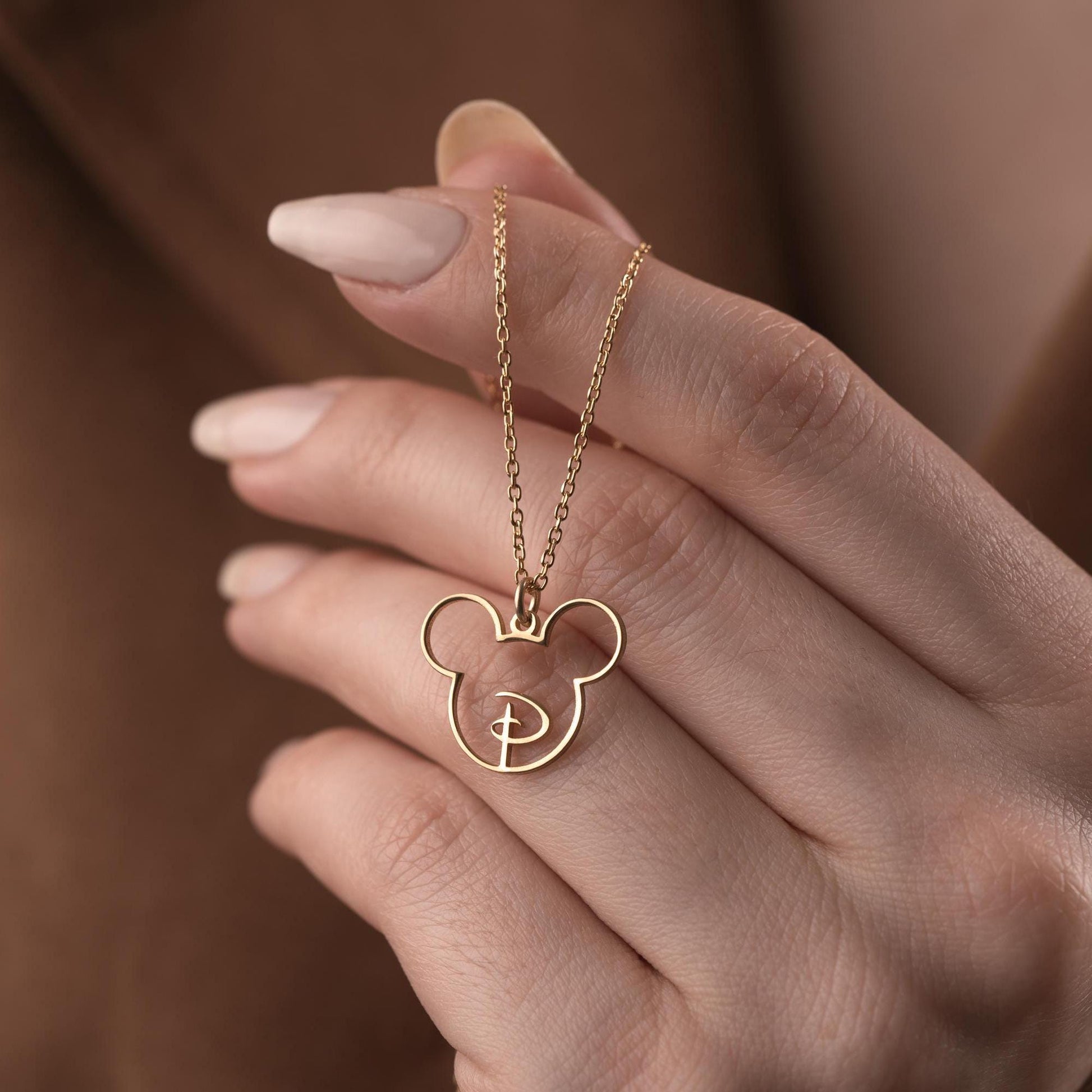 Custom initial necklace with a unique letter-in-pendant design, crafted in 925 sterling silver or 14k gold plated. A personalized and elegant handmade jewelry gift.