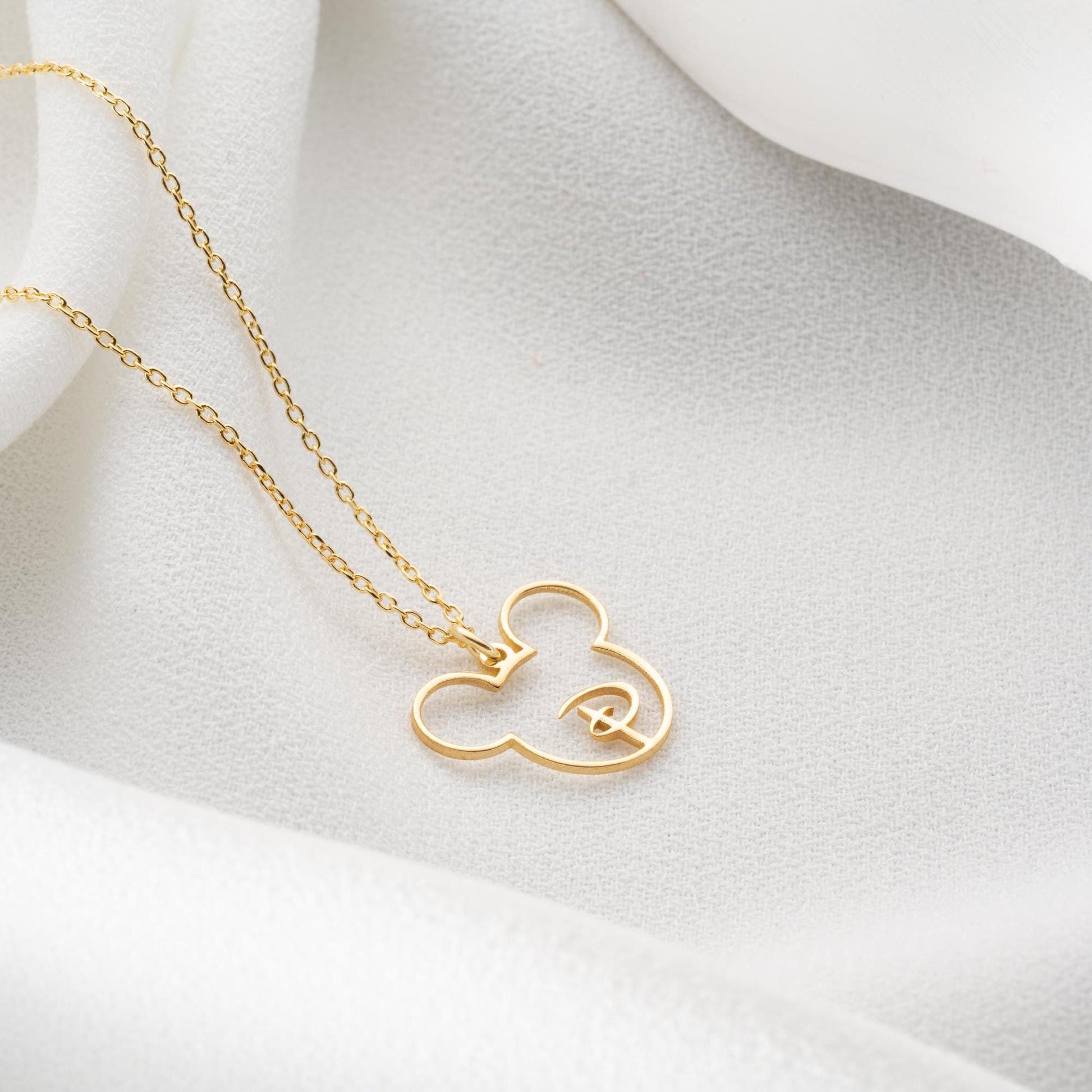 Custom initial necklace with a unique letter-in-pendant design, crafted in 925 sterling silver or 14k gold plated. A personalized and elegant handmade jewelry gift.