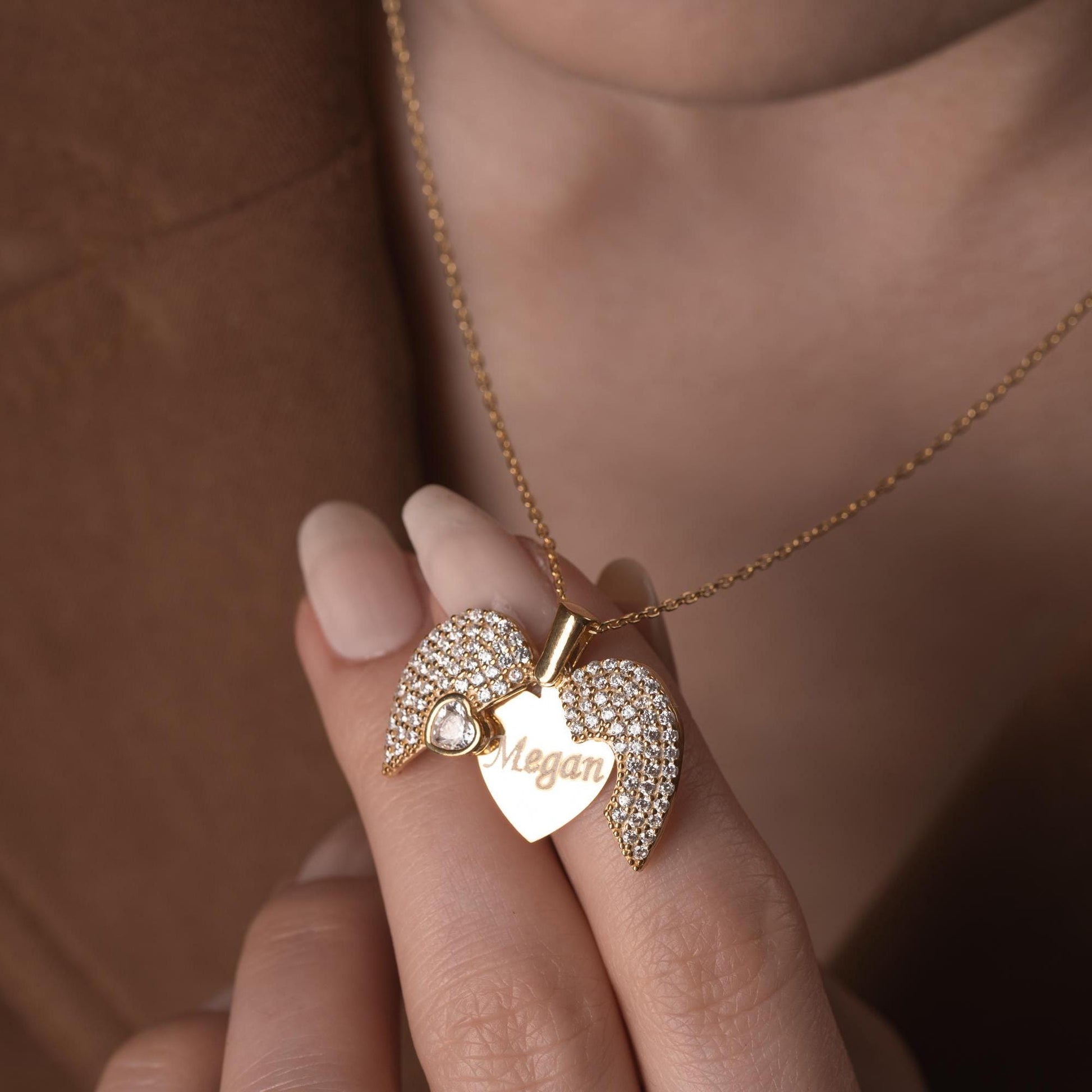 Personalized heart necklace with angel wings and name engraving, available in 925 sterling silver, 14k gold, and rose gold plated options. A meaningful, handmade jewelry gift for loved ones.