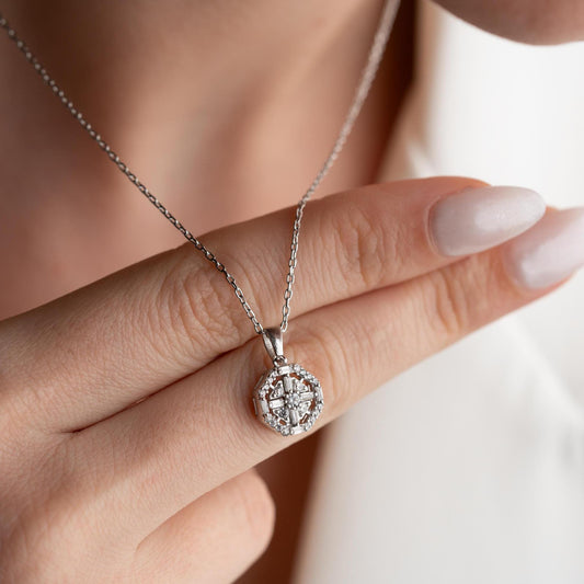 Octagon pendant necklace with cubic zirconia stones, available in 925 sterling silver and 14K gold plated options, displayed on a white satin background