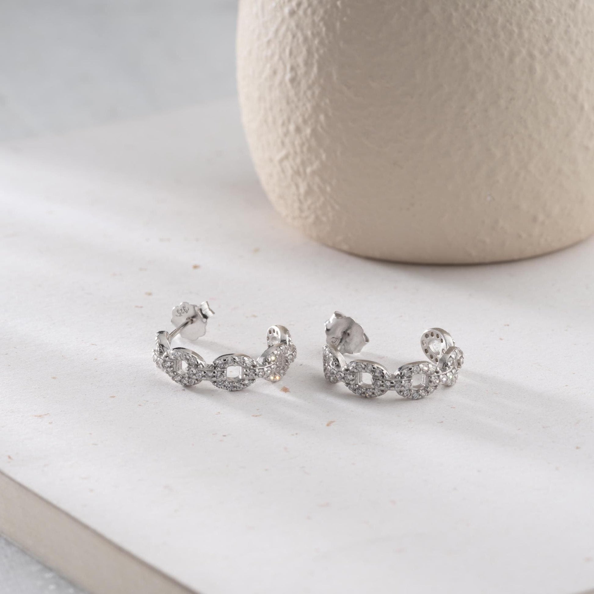 Chain link hoop earrings in 925 sterling silver with 14K gold plated option, adorned with sparkling cubic zirconia stones, ideal for gifting.