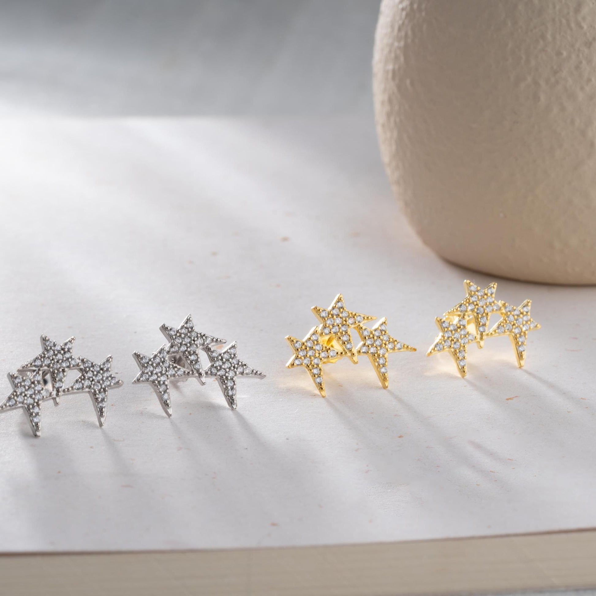 Star cluster earrings in 925 Sterling Silver and 14K Gold Plated options, adorned with cubic zirconia stones for an elegant holiday look.