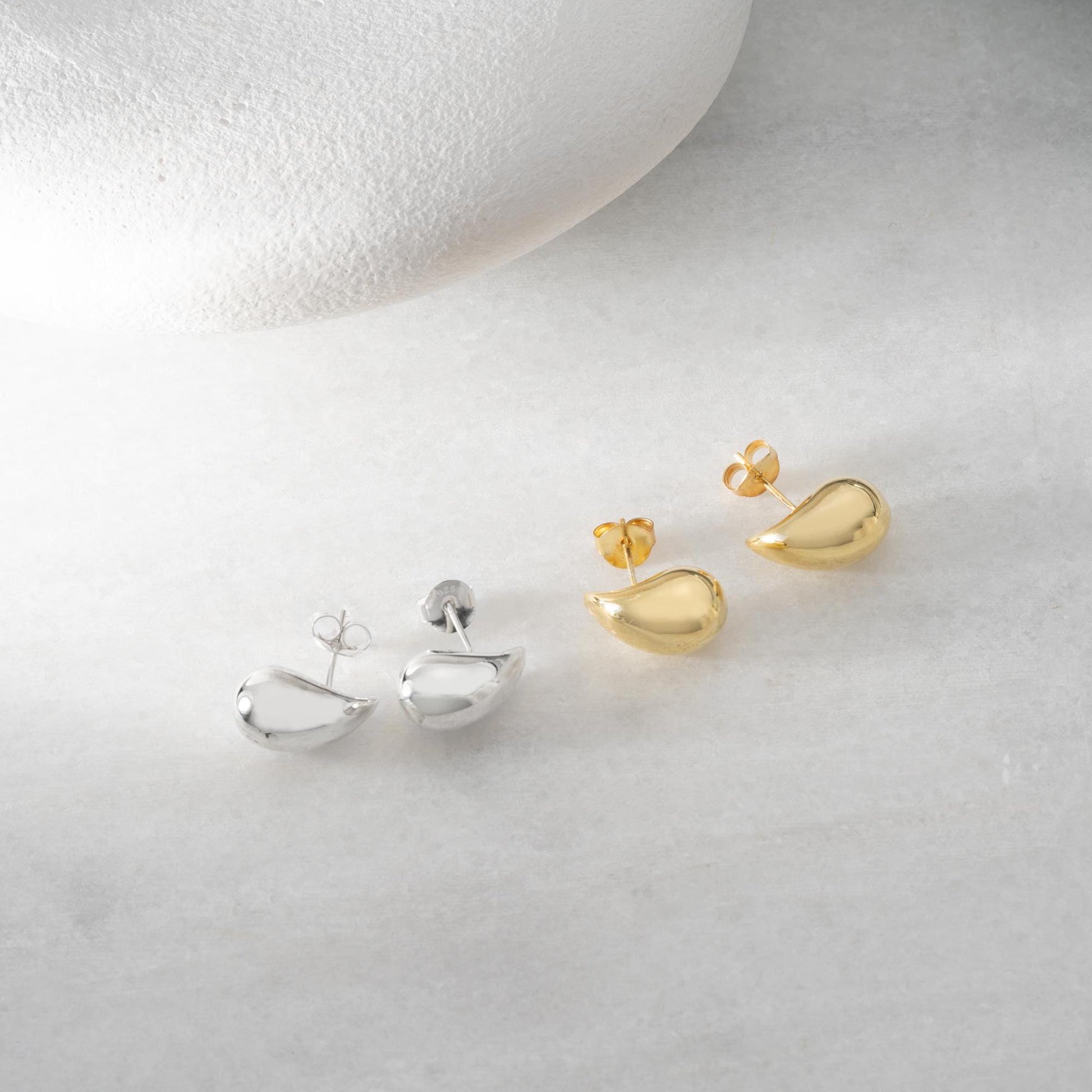 Teardrop-shaped stud earrings crafted from 925 sterling silver with a 14K gold-plated option, featuring a push back closure, perfect for Christmas gifting and everyday wear.