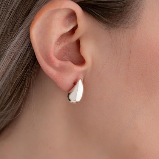 Teardrop-shaped stud earrings crafted from 925 sterling silver with a 14K gold-plated option, featuring a push back closure, perfect for Christmas gifting and everyday wear.