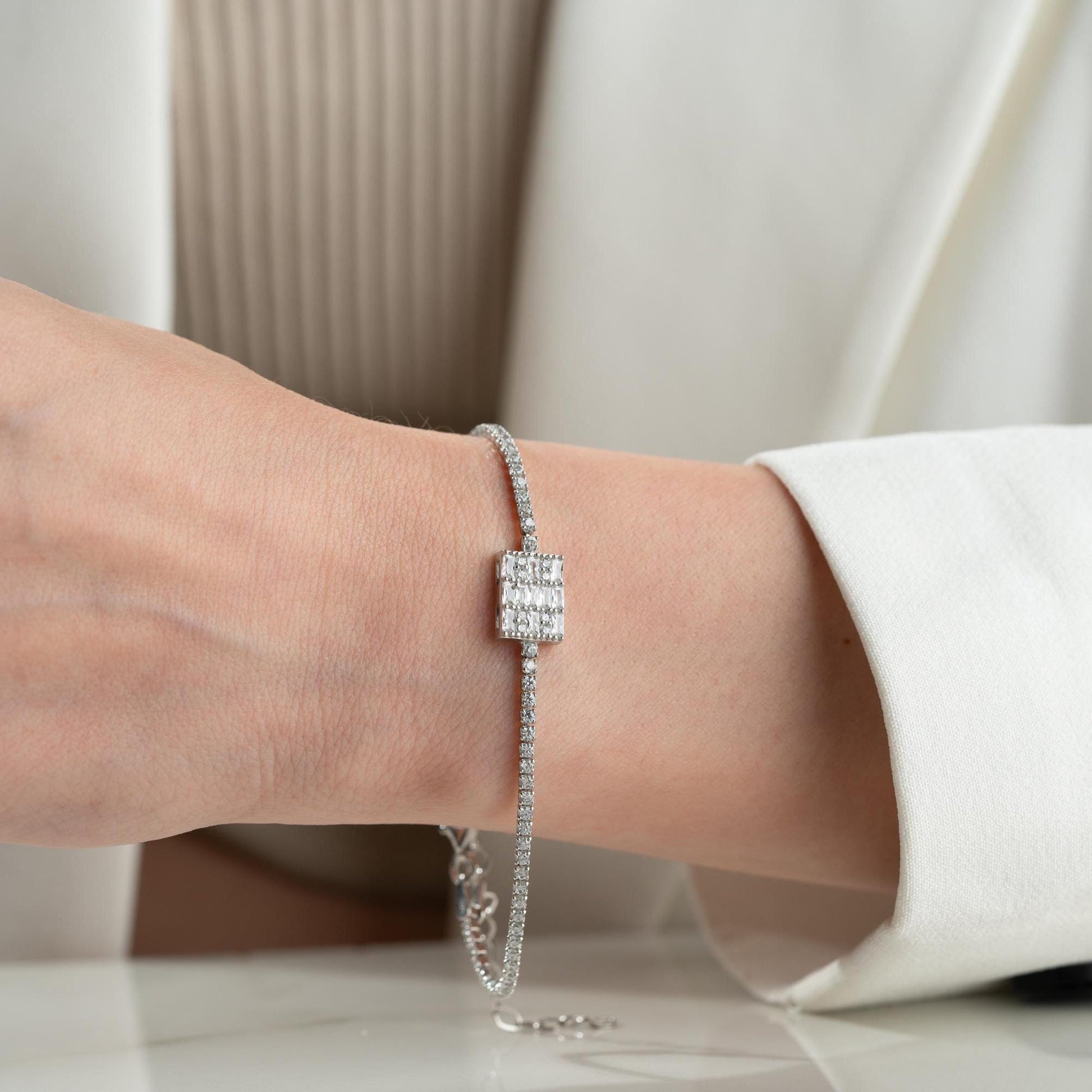 Tennis bracelet with cubic zirconia stones in 925 sterling silver and 14K gold plated options.