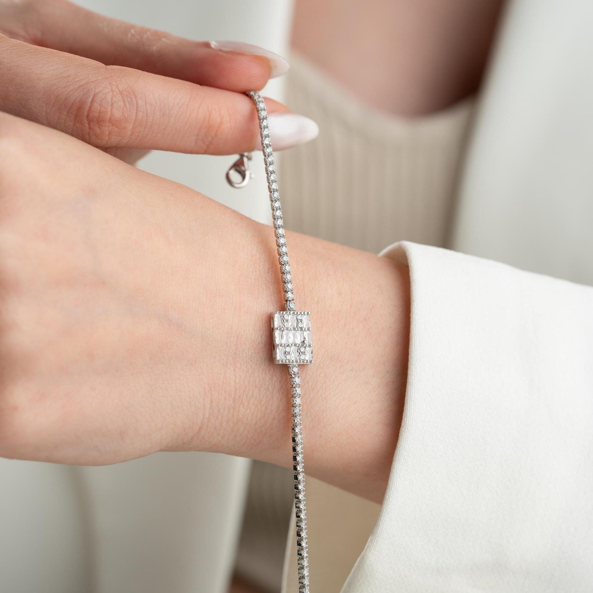Tennis bracelet with cubic zirconia stones in 925 sterling silver and 14K gold plated options.