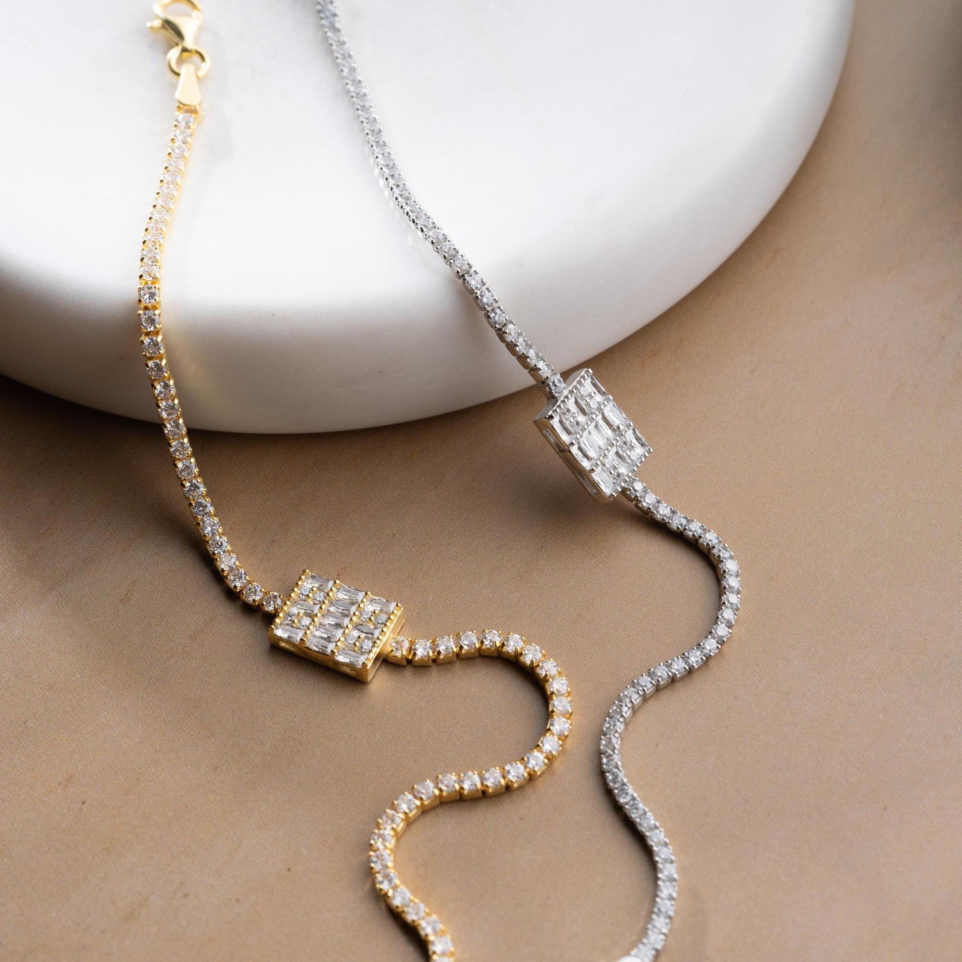 Tennis bracelet with cubic zirconia stones in 925 sterling silver and 14K gold plated options.