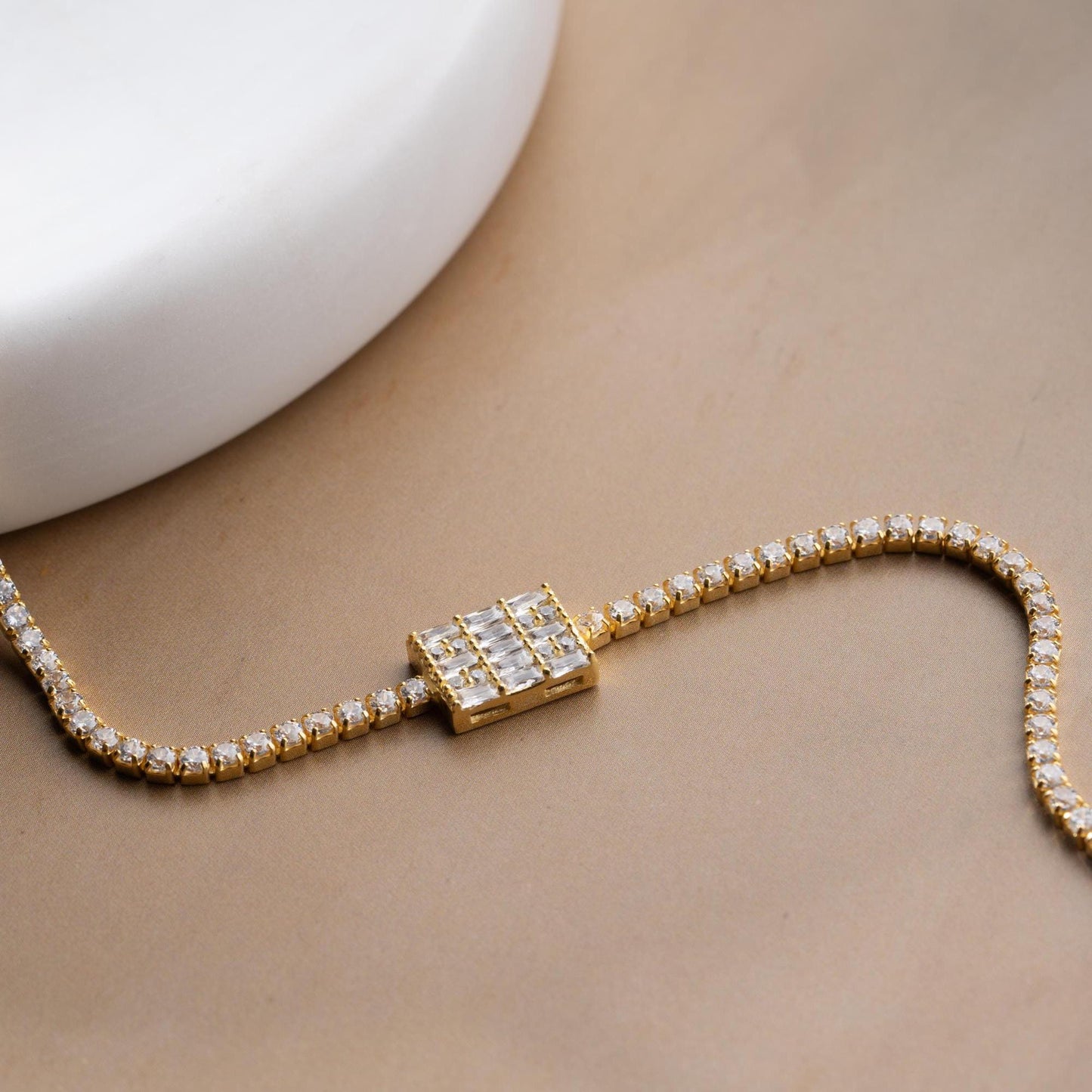 Tennis bracelet with cubic zirconia stones in 925 sterling silver and 14K gold plated options.