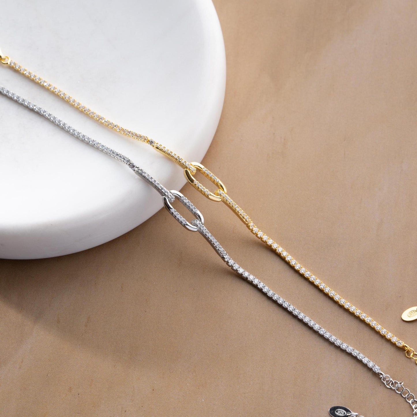 Elegant link chain tennis bracelet with cubic zirconia stones, crafted in 925 Sterling Silver and available in silver and gold finishes, perfect for festive gifting.