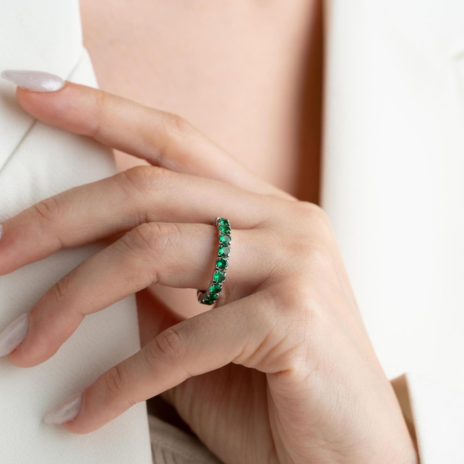 Single vibrant tennis ring crafted in 925 Sterling Silver with colorful cubic zirconia stones, available in rainbow, red, blue, green, black, and pink.