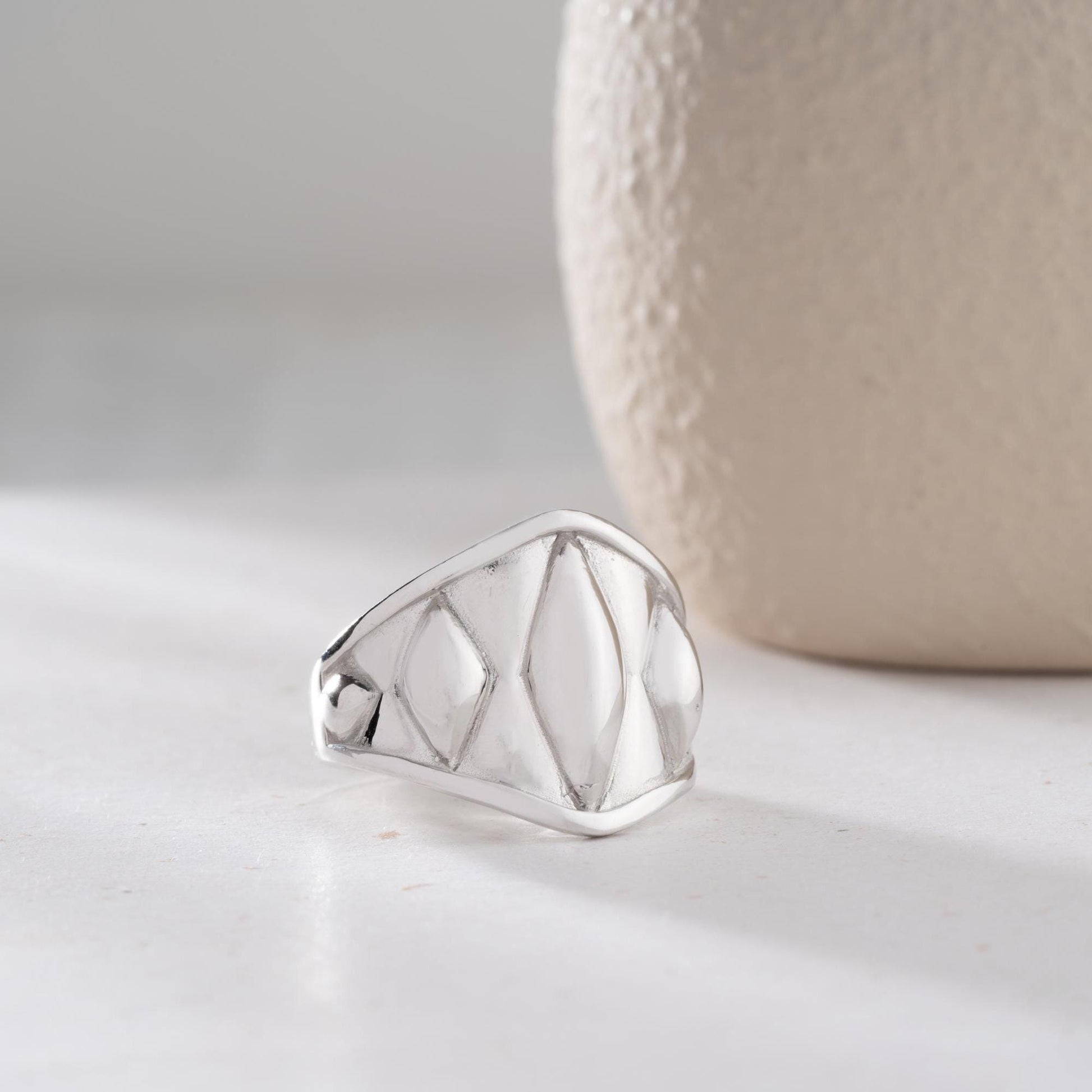 Chunky geometric signet ring with bold diamond-shaped design, crafted from 925 sterling silver and available in 14K gold plating. A modern and adjustable statement piece for men and women.