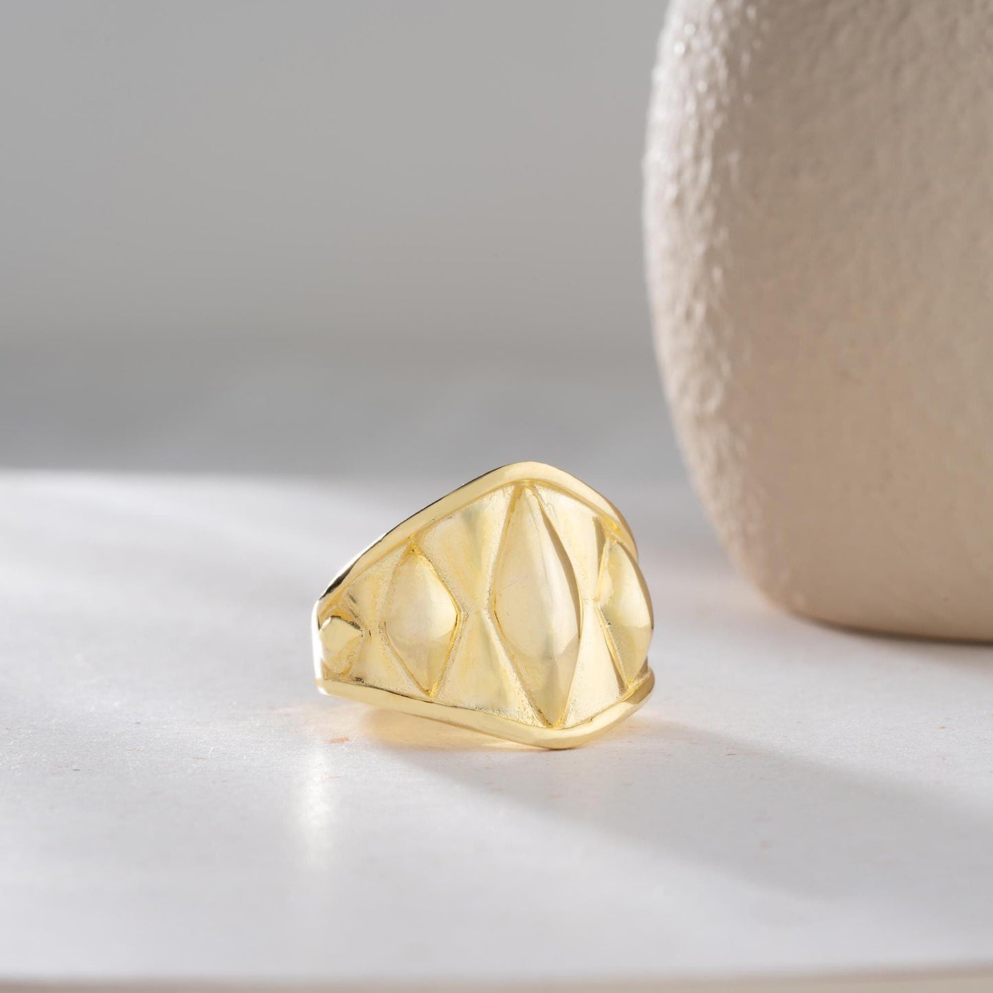 Chunky geometric signet ring with bold diamond-shaped design, crafted from 925 sterling silver and available in 14K gold plating. A modern and adjustable statement piece for men and women.