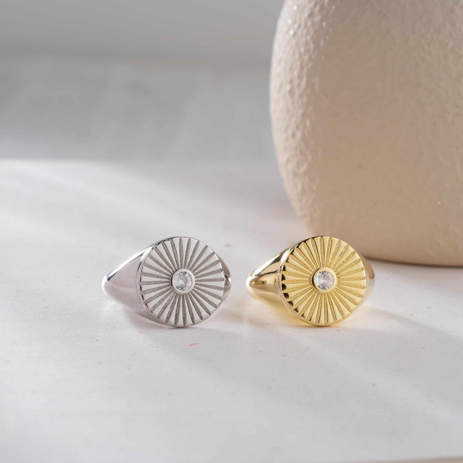 Sunburst engraved statement ring in 925 sterling silver and 14K gold plating with a center cubic zirconia stone.
