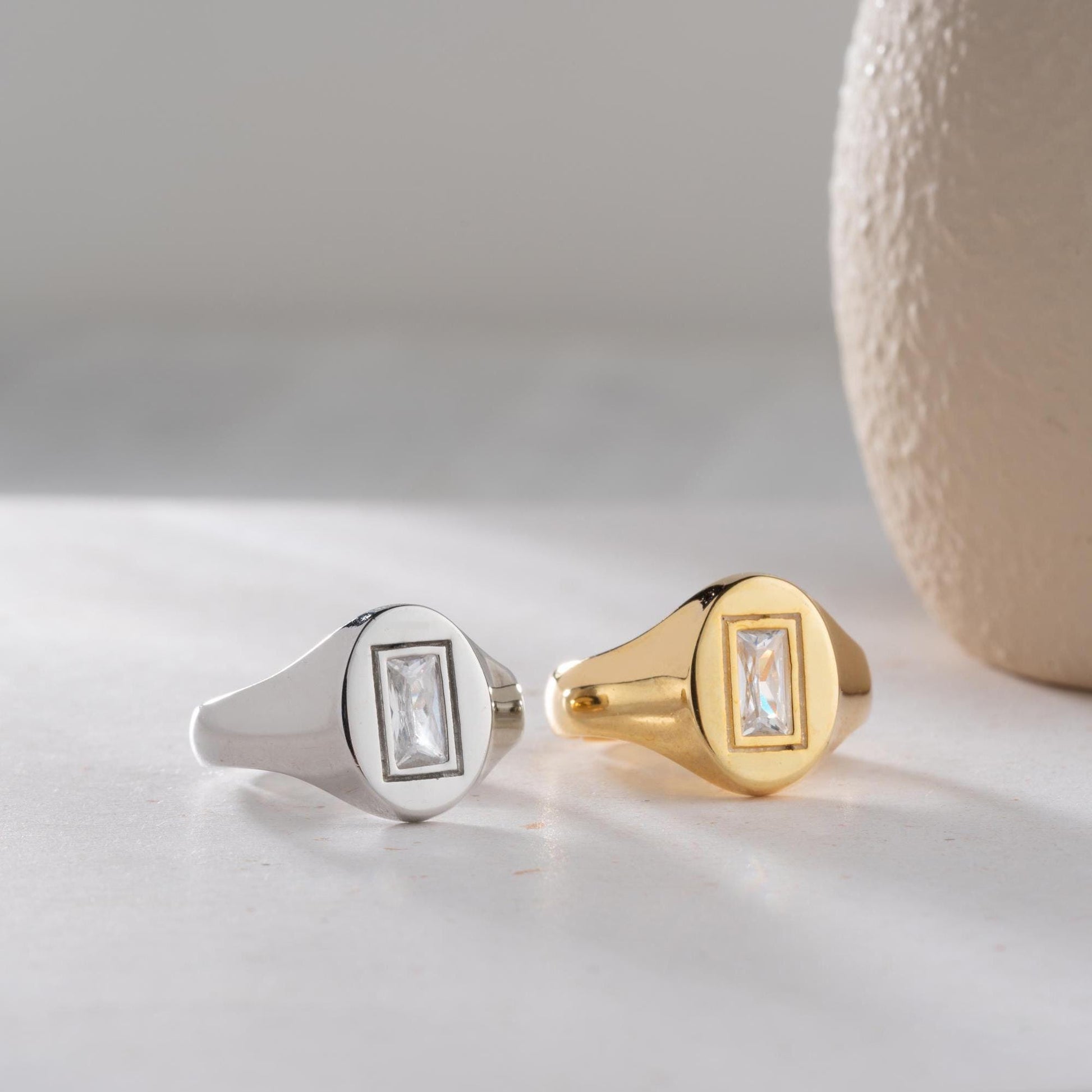 Baguette signet ring featuring a sleek baguette-cut cubic zirconia stone, crafted from 925 Sterling Silver with gold plating option, elegant for daily wear or gifting.