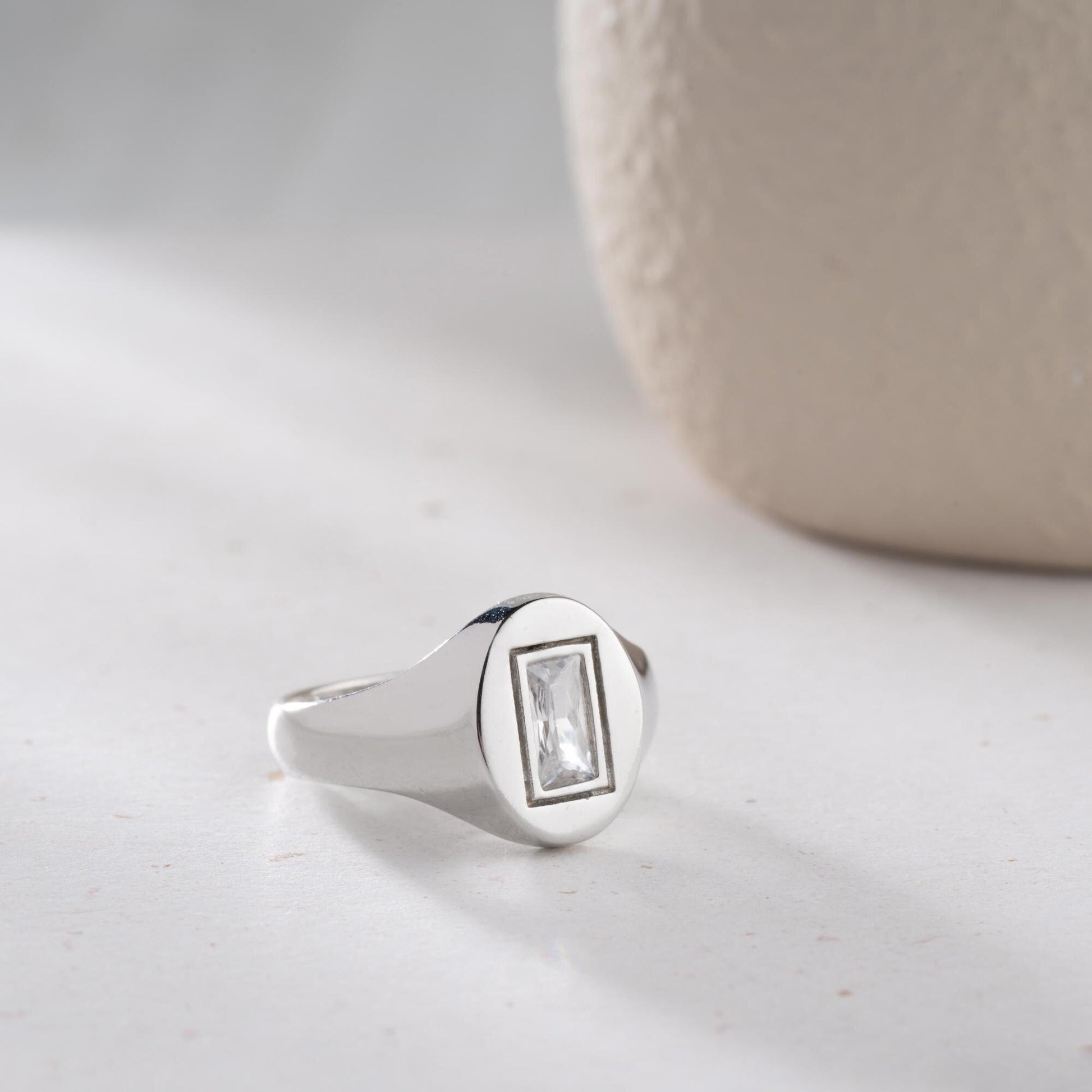 Baguette signet ring featuring a sleek baguette-cut cubic zirconia stone, crafted from 925 Sterling Silver with gold plating option, elegant for daily wear or gifting.
