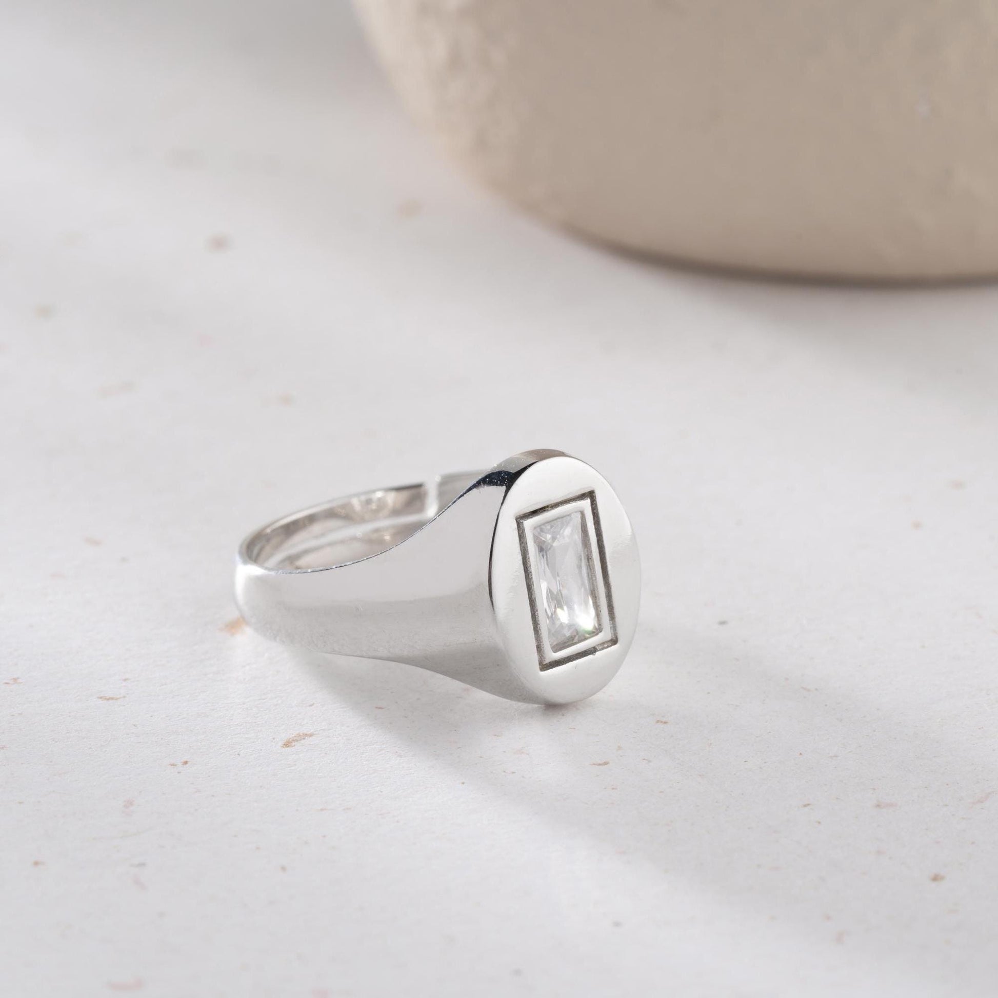 Baguette signet ring featuring a sleek baguette-cut cubic zirconia stone, crafted from 925 Sterling Silver with gold plating option, elegant for daily wear or gifting.