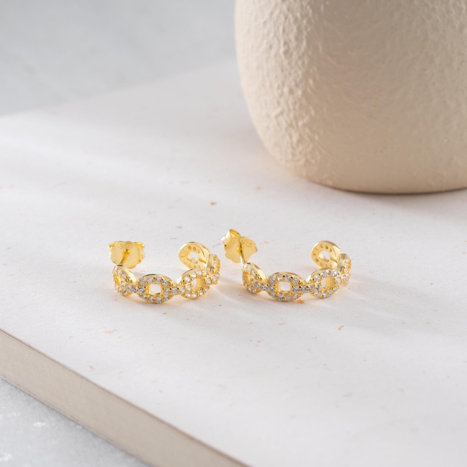 Chain link hoop earrings in 925 sterling silver with 14K gold plated option, adorned with sparkling cubic zirconia stones, ideal for gifting.