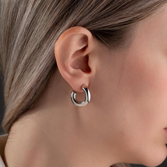Chunky hoop earrings crafted from 925 sterling silver with a 14K gold-plated option, perfect for a minimalist yet bold look.