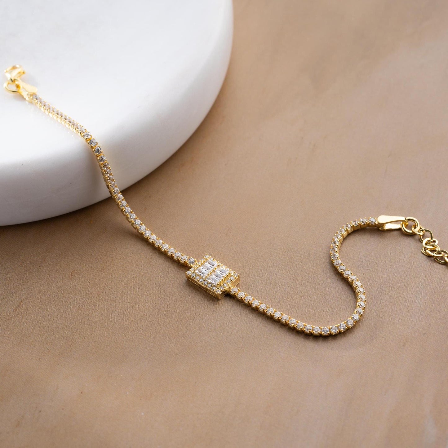 Elegant baget bracelet with cubic zirconia stones, made of 925 sterling silver, available in silver and gold finishes.