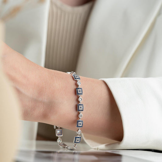 Square motif charm bracelet in 925 Sterling Silver with cubic zirconia stones, available in silver and gold finishes, perfect for Christmas gifts.