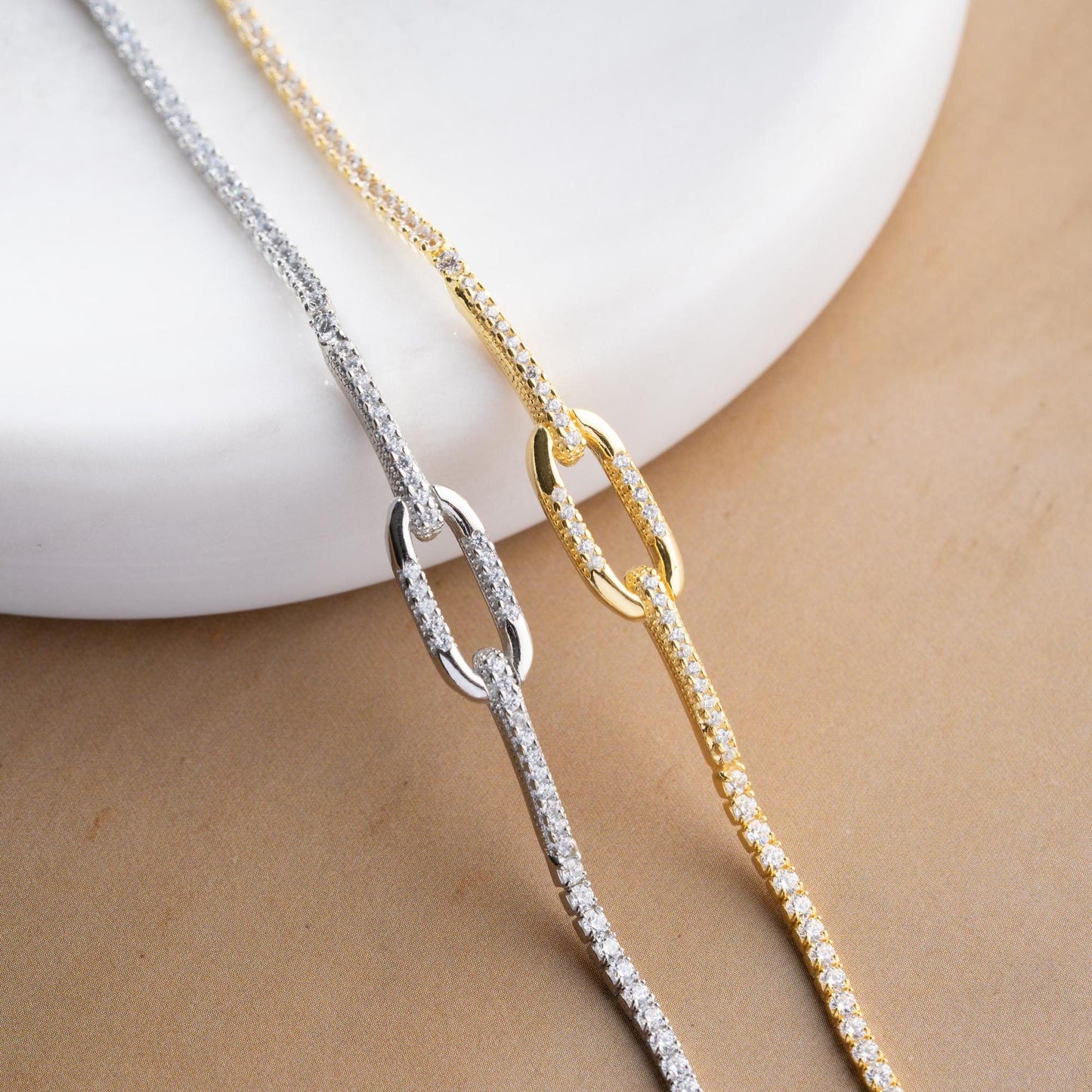 Elegant link chain tennis bracelet with cubic zirconia stones, crafted in 925 Sterling Silver and available in silver and gold finishes, perfect for festive gifting.