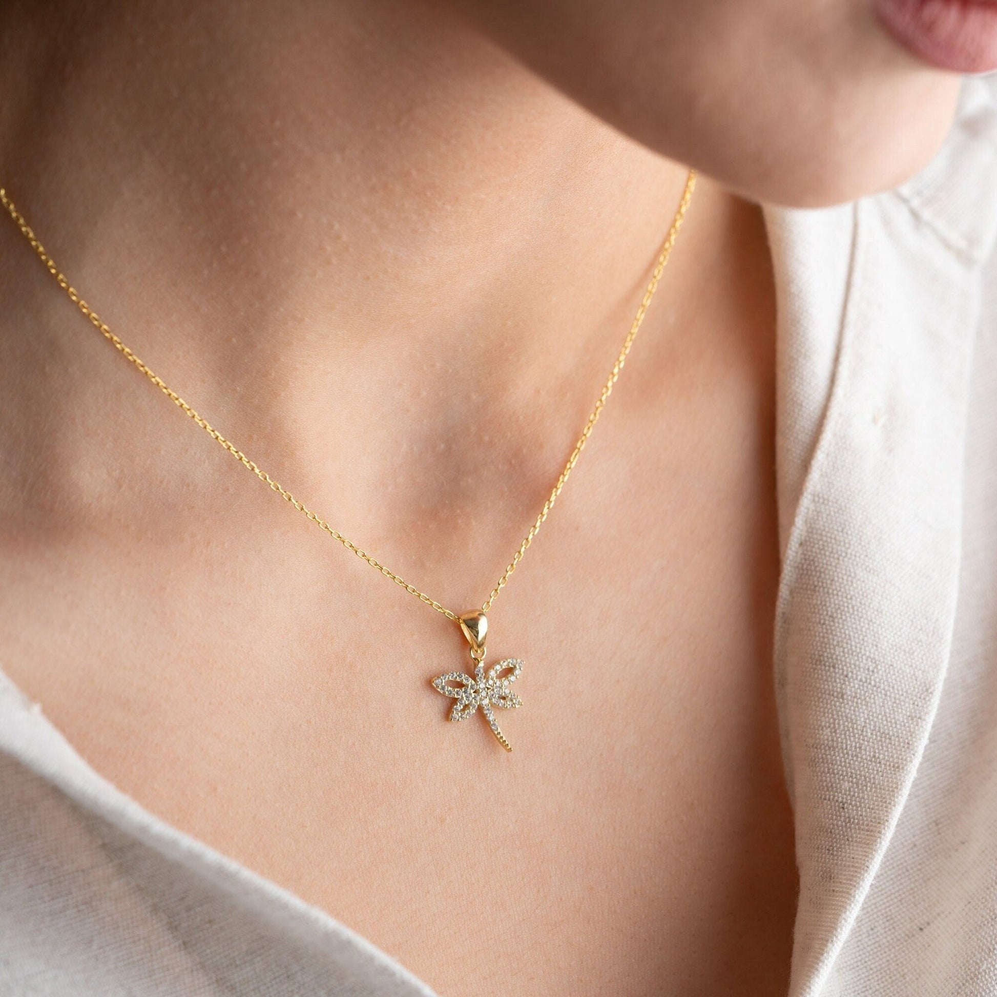 Elegant dragonfly pendant necklace with zircon stones on sterling silver.