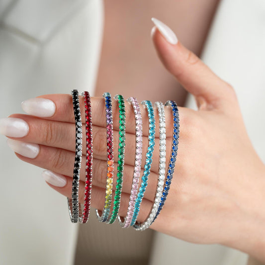 Vibrant stackable tennis bracelet set featuring multicolored cubic zirconia stones, crafted in 925 Sterling Silver with a 14K Gold Plated option, perfect for festive and everyday wear.