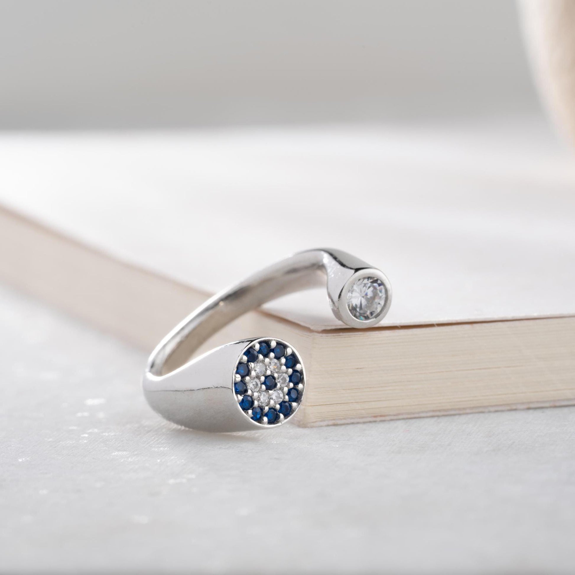 Adjustable open ring featuring a round evil eye charm with cubic zirconia stones, crafted in 925 Sterling Silver and 14K Gold Plated finish.