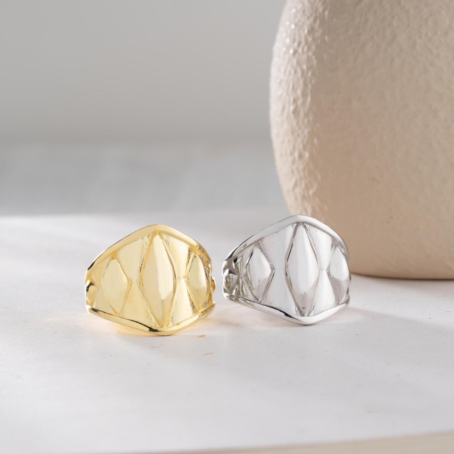 Chunky geometric signet ring with bold diamond-shaped design, crafted from 925 sterling silver and available in 14K gold plating. A modern and adjustable statement piece for men and women.