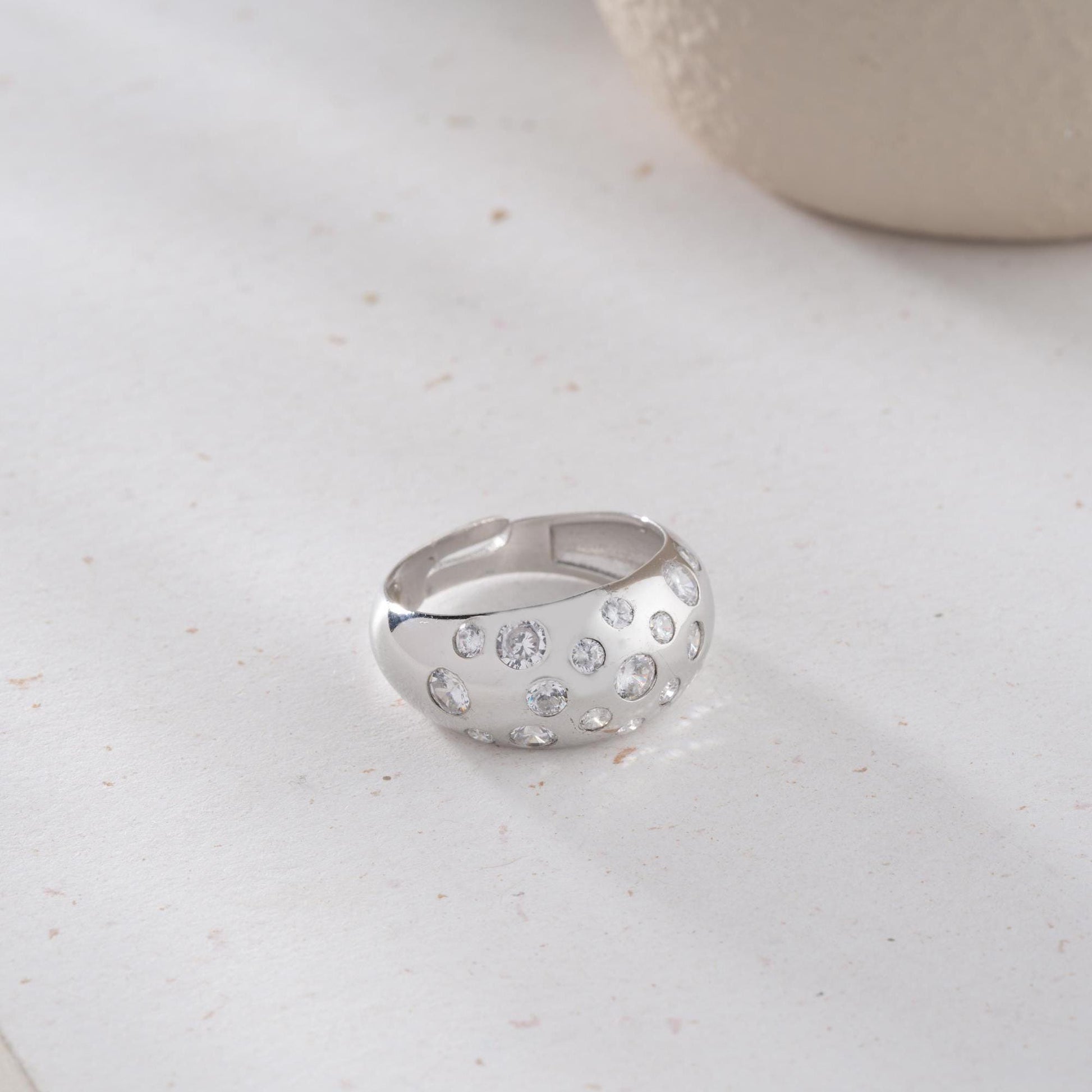 Elegant pave dome ring featuring dazzling cubic zirconia stones, crafted in 925 sterling silver with 14K gold plated options. A luxurious, adjustable statement ring for women.