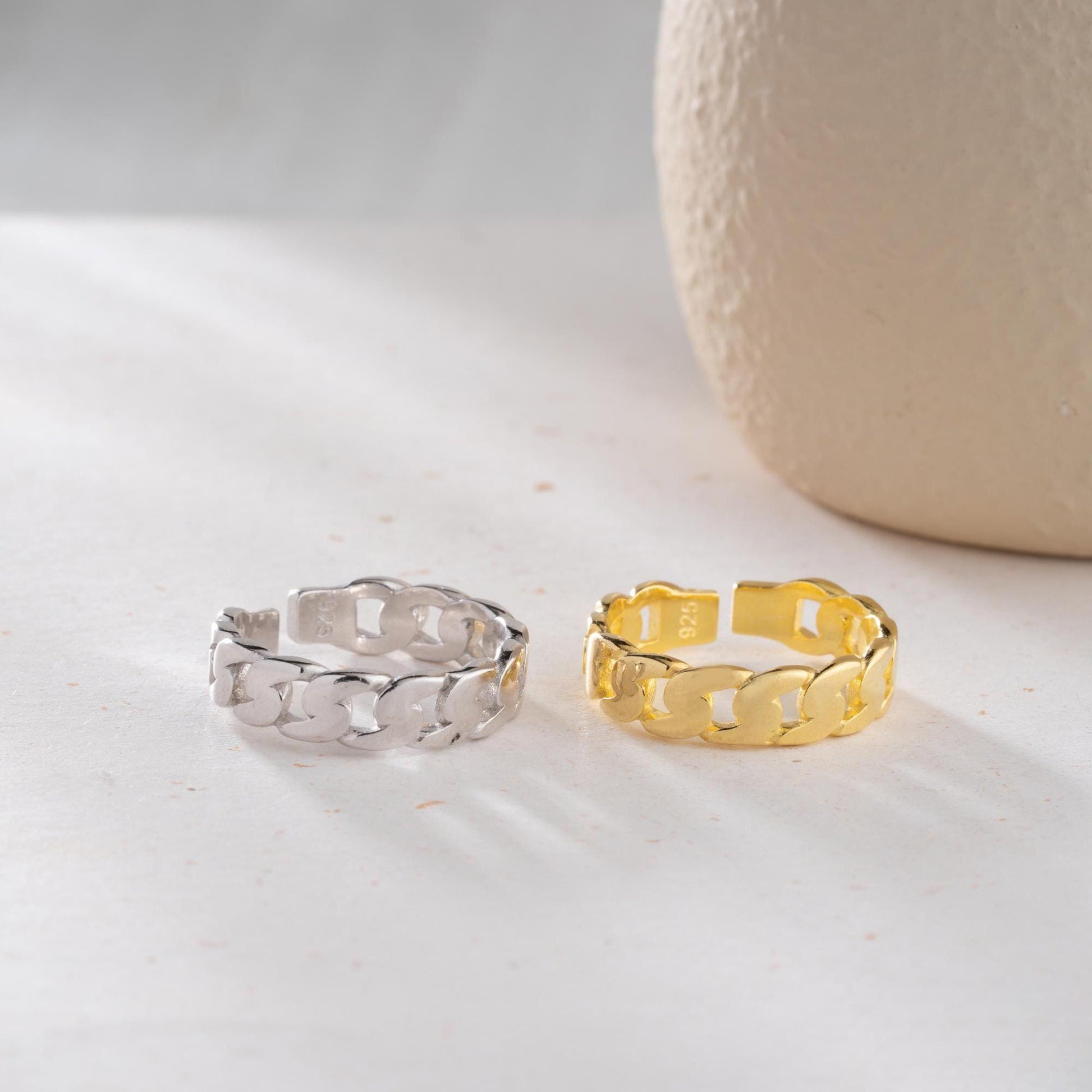 Chunky chain link ring crafted from 925 sterling silver with 14K gold plating, featuring an adjustable open band. Stylish unisex jewelry perfect for bold statement looks.