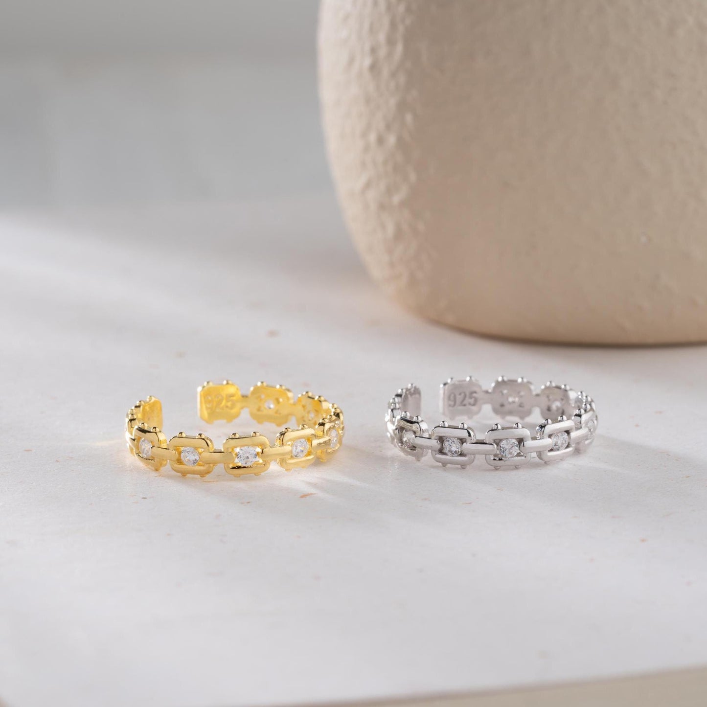 A dazzling chain link eternity ring with cubic zirconia stones, handcrafted from 925 sterling silver and available in silver or 14K gold plated finishes. Ideal for birthdays, anniversaries, and gifts for her.