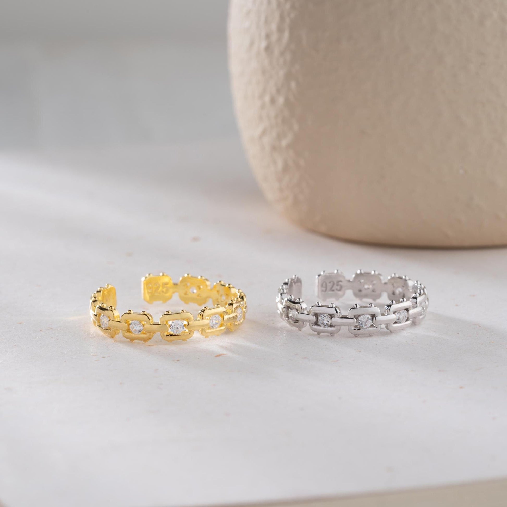 A dazzling chain link eternity ring with cubic zirconia stones, handcrafted from 925 sterling silver and available in silver or 14K gold plated finishes. Ideal for birthdays, anniversaries, and gifts for her.