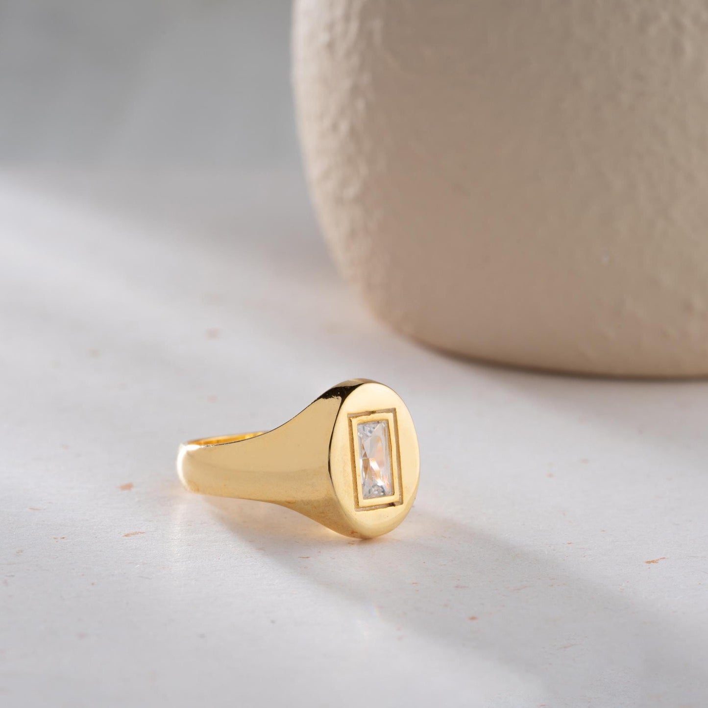 Baguette signet ring featuring a sleek baguette-cut cubic zirconia stone, crafted from 925 Sterling Silver with gold plating option, elegant for daily wear or gifting.