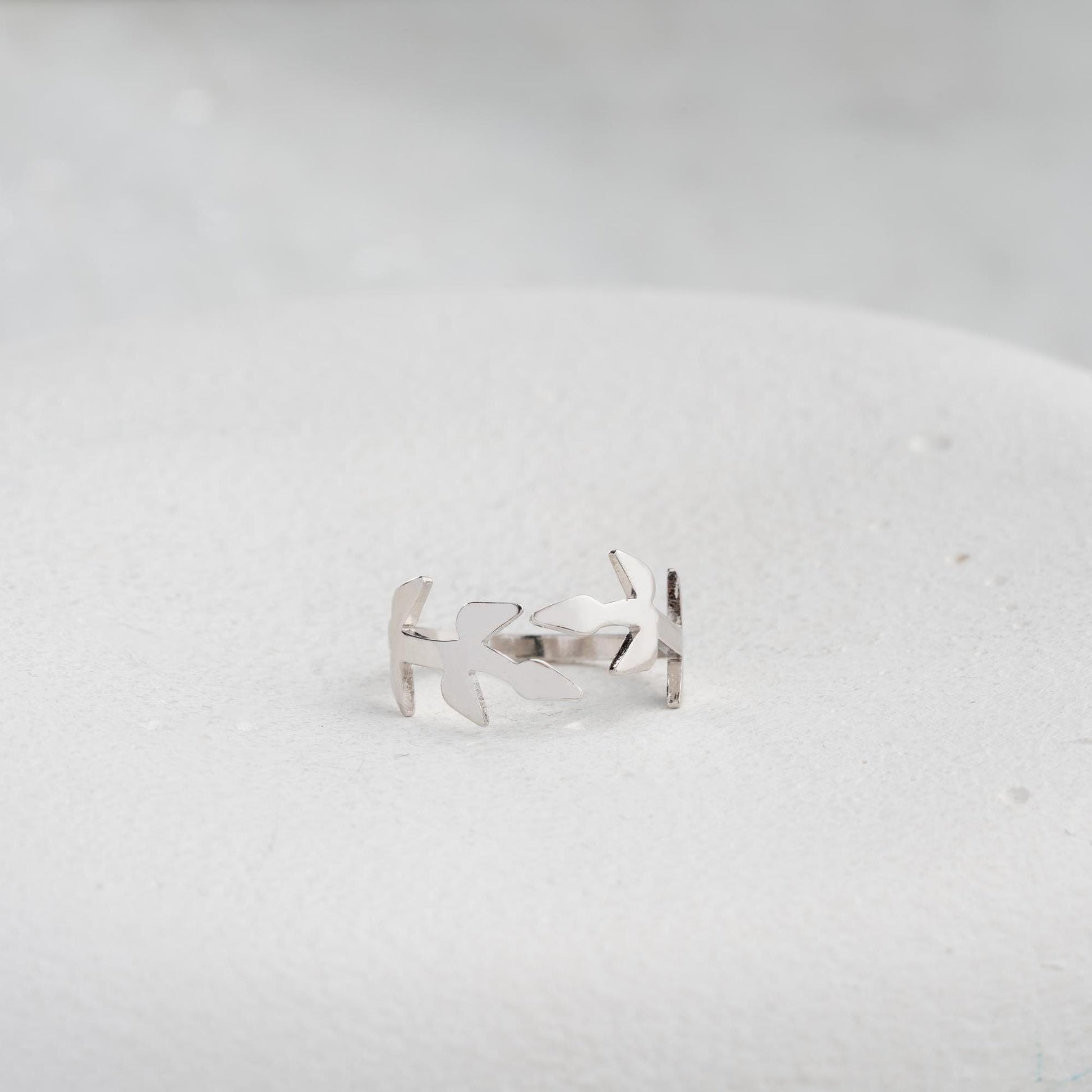 A delicate olive branch-inspired ring crafted from 925 Sterling Silver, available in gold and rose gold plating. Adjustable open band, perfect for nature lovers and elegant gifting.